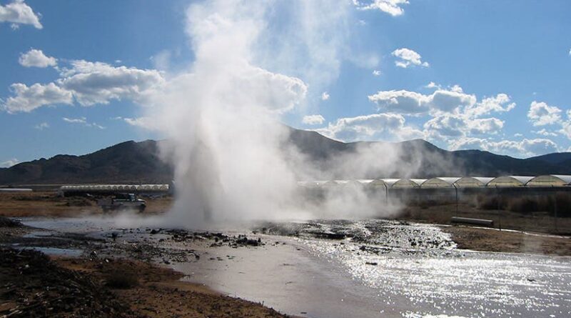 Geothermally heated water well
