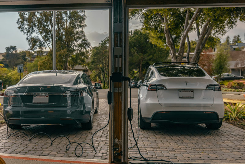 The NeoCharge Smart Splitter in a 240V dryer outlet, this device allows Tesla owners to charge two Teslas simultaneously without expensive installations or panel upgrades.