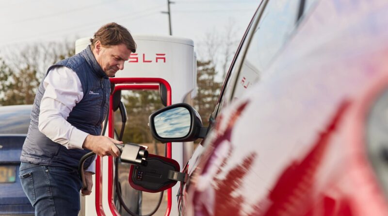 Ford CEO Jim Farley chargest his Mustang Mach-e EV at a Tesla Supercharger in February, 2024.