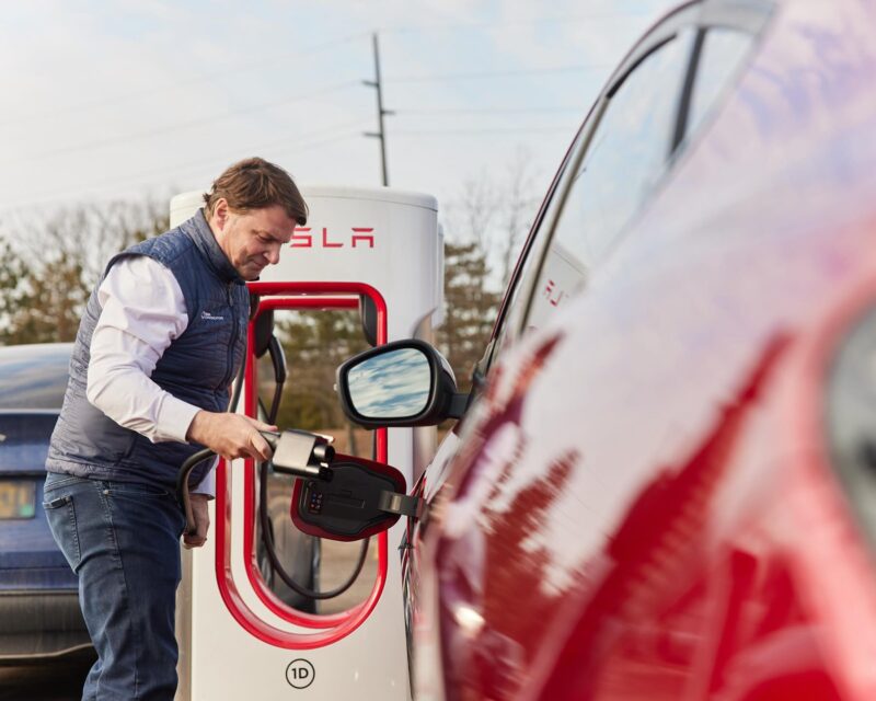 Ford CEO Jim Farley chargest his Mustang Mach-e EV at a Tesla Supercharger in February, 2024.