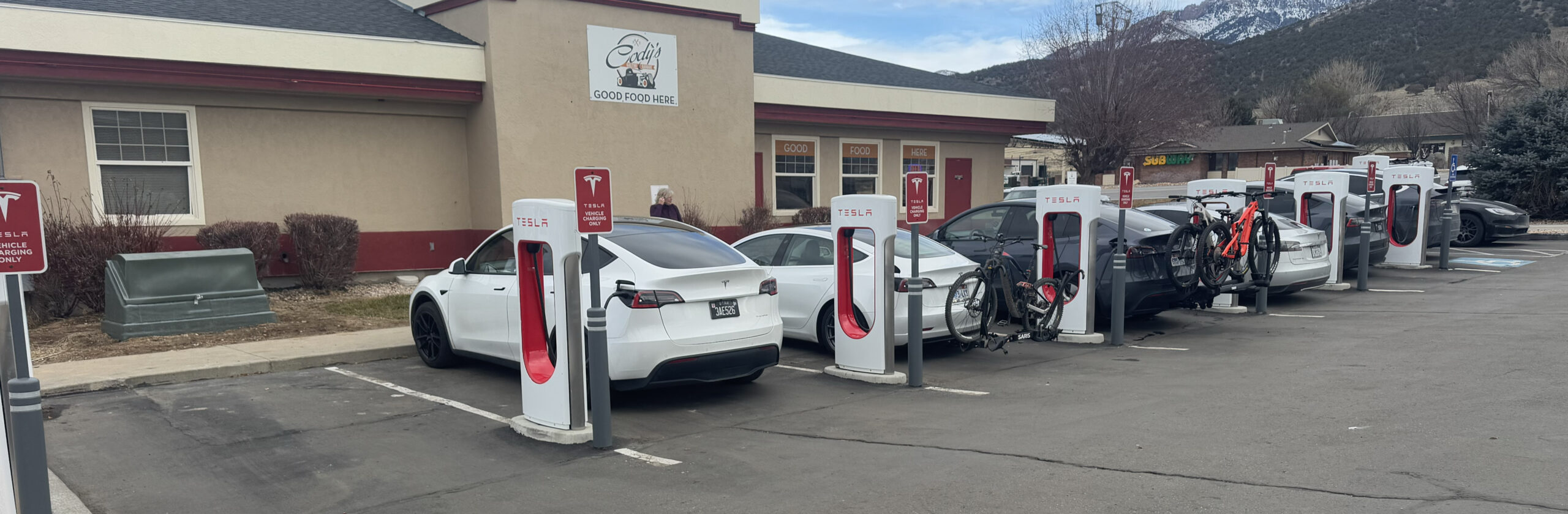 9462 7 of 8 drive through supercharging stalls full. Tesla NACS Supercharger. Nina Utah. January 1 2024. Photo by Fritz Hasler scaled